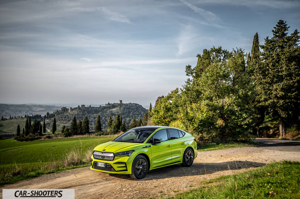 Skoda Enyaq – front three-quarter, lime green on a country road