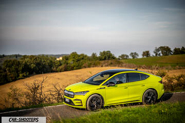 Skoda Enyaq – front three-quarter, yellow on a country road