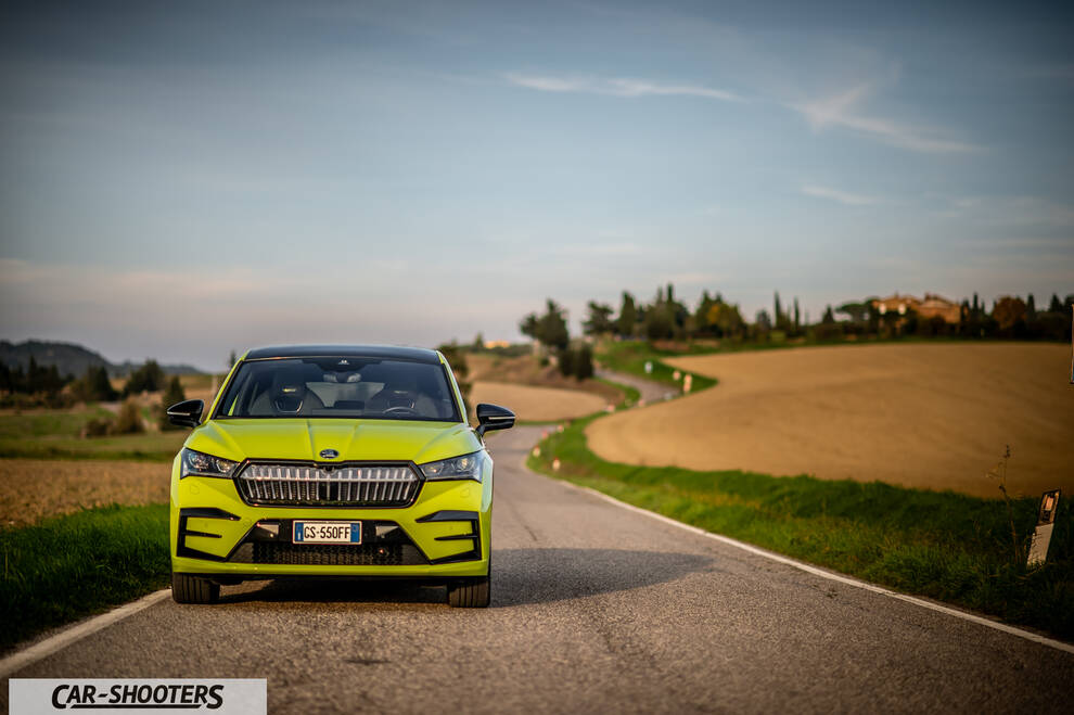 Skoda Enyaq – front three-quarter, yellow-green on a country road