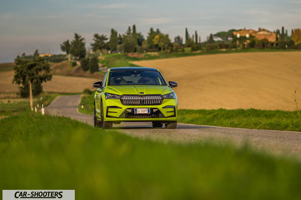 Skoda Enyaq – front three-quarter, yellow-green on a country road