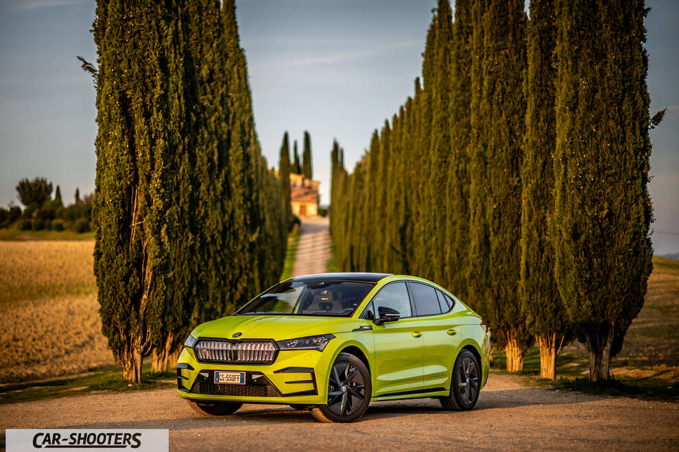 Skoda Enyaq – front three-quarter, yellow-green on a country road