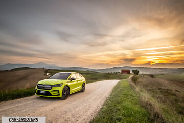 Skoda Enyaq – front three-quarter, yellow-green on a country road