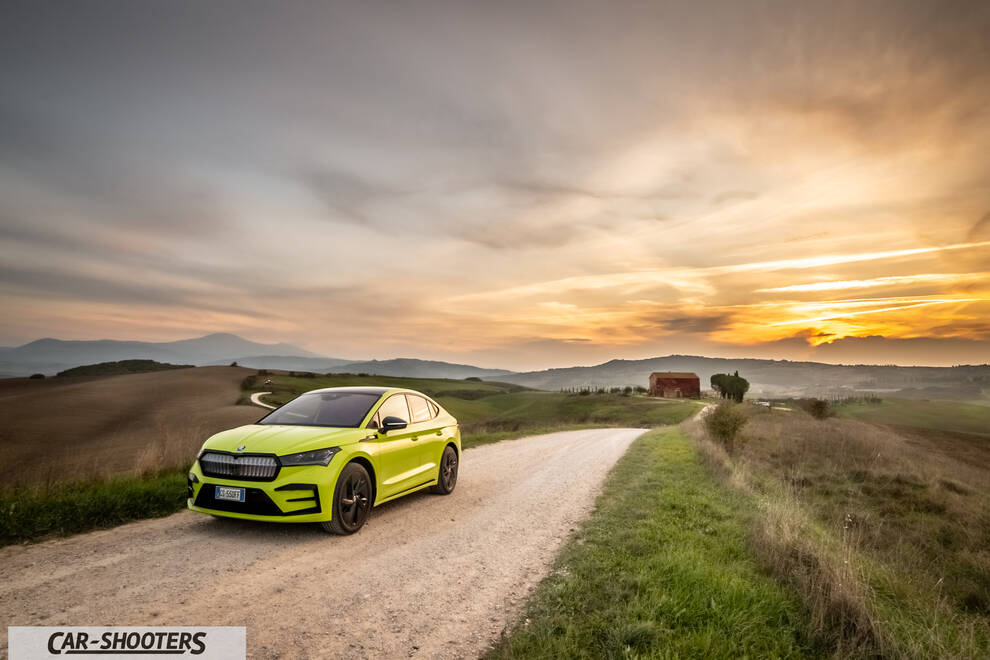 Skoda Enyaq – front three-quarter, yellow-green on a country road