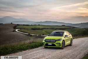 Skoda Enyaq – front three-quarter, yellow against a mountain backdrop