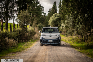 Volkswagen ID BUZZ – front three-quarter, silver and blue on a country road