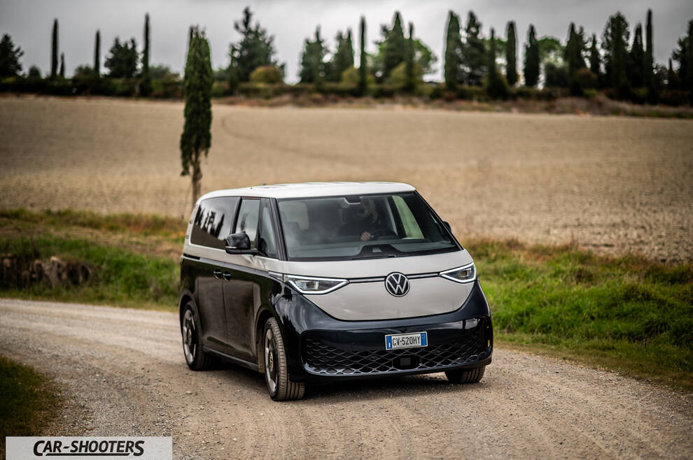 Volkswagen ID BUZZ – front three-quarter, two tone beige and black on a country road