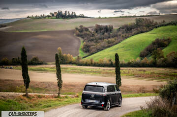 Volkswagen ID BUZZ – rear view, black and silver on a country road