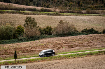 Volkswagen ID BUZZ – side profile, black and white on a country road