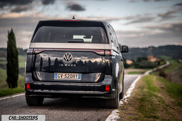 Volkswagen ID BUZZ – rear view, black and silver on a country road