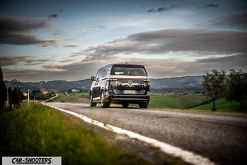 Volkswagen ID BUZZ – rear view, black on a country road
