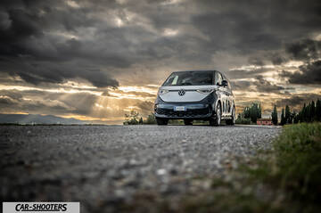 Volkswagen ID BUZZ – front three-quarter, silver and blue on a country road
