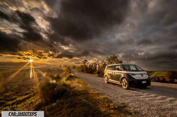 Volkswagen ID BUZZ – front three-quarter, grey and white on a country road