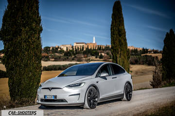 Tesla Model X – front three-quarter, silver on a country road