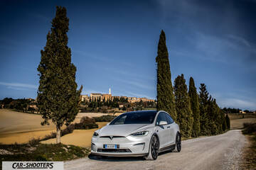 Tesla Model X – front three-quarter, silver on a country road