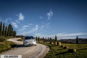 Tesla Model X – front three-quarter, silver on a country road