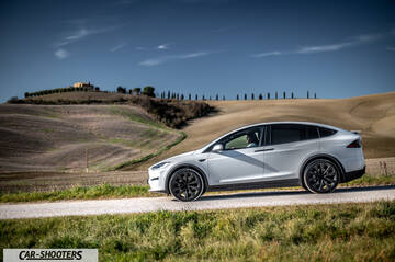 Tesla Model X – side profile, white on a country road