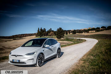 Tesla Model X – front three-quarter, white on a country road