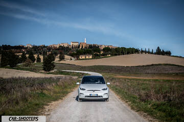 Tesla Model X – front three-quarter, white on a country road