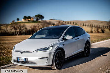 Tesla Model X – front three-quarter, white on a country road