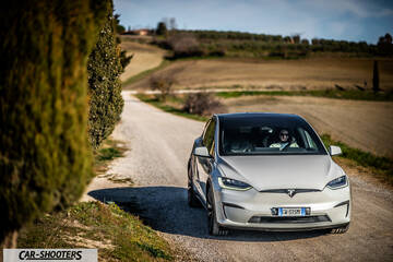 Tesla Model X – front three-quarter, white on a country road