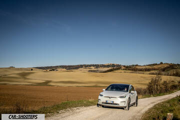 Tesla Model X – front three-quarter, white on a country road