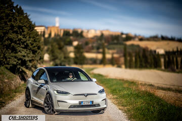 Tesla Model X – front three-quarter, silver on a country road