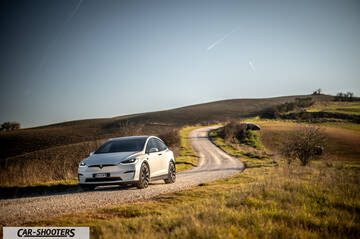 Tesla Model X – front three-quarter, white on a country road