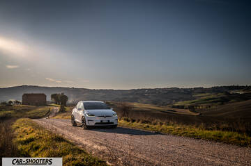 Tesla Model X – front three-quarter, white on a country road