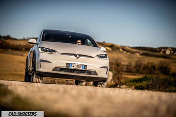 Tesla Model X – front three-quarter, white on a country road