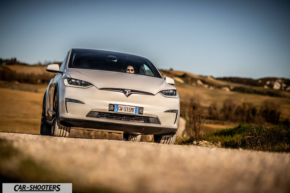 Tesla Model X – front three-quarter, white on a country road
