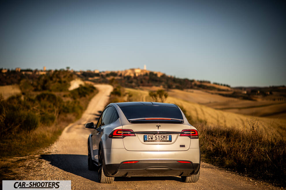 Tesla Model X – rear view, silver on a country road