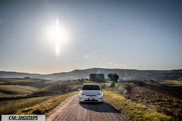 Tesla Model X – front three-quarter, white on a country road
