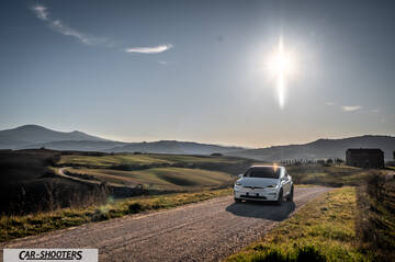 Tesla Model X – front three-quarter, white on a country road
