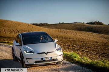 Tesla Model X – front three-quarter, white on a country road