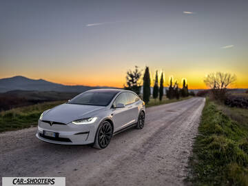 Tesla Model X – front three-quarter, white on a country road