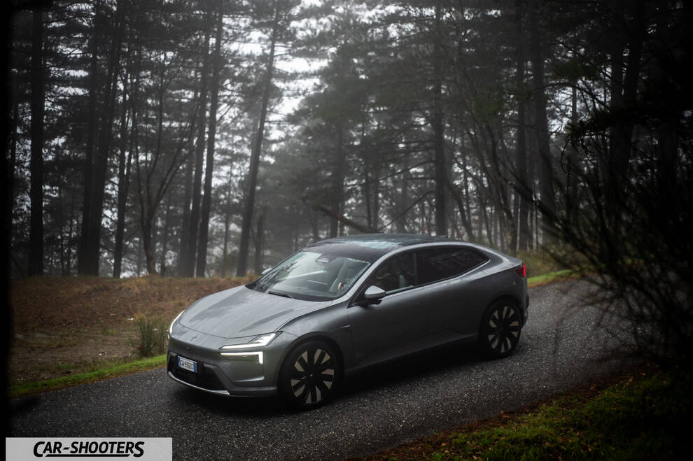 Polestar 4 – front three-quarter, grey metallic on a forest road
