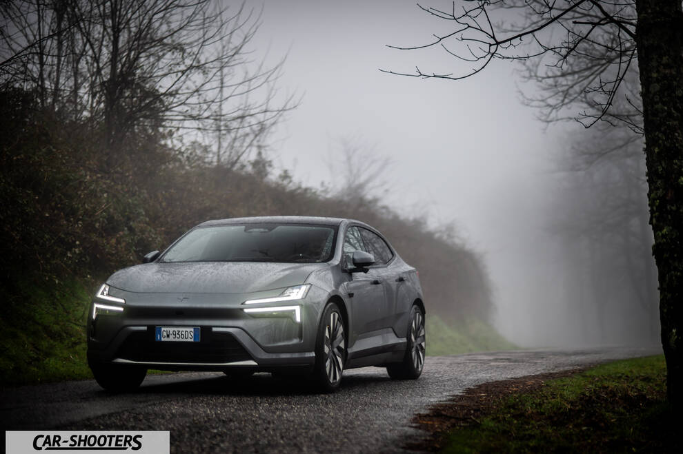 Polestar 4 – front three-quarter, silver metallic on a country road