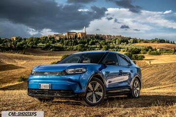 Ford Capri – front three-quarter, blue against a rustic landscape backdrop