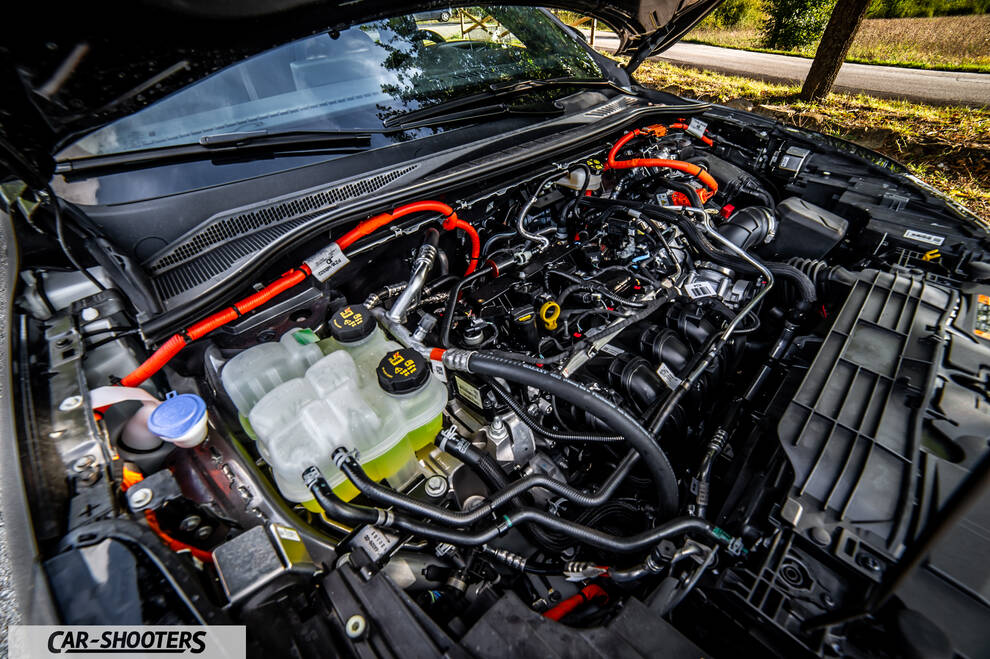 Ford Kuga 2025 – engine bay, with bright orange high voltage cables